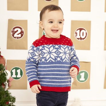 Baby Christmas jumper for. Red, blue and cream with snowflakes.