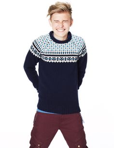 Sophisticated child's Christmas jumper. Dark blue with pattern across the shoulders.