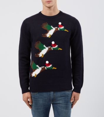 Men's xmas jumper with three flying ducks.