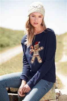 Ladies sweatshirt in blue with ginger-bread man design.