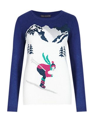 Winter novelty jumper featuring woman skiiing in mountains.