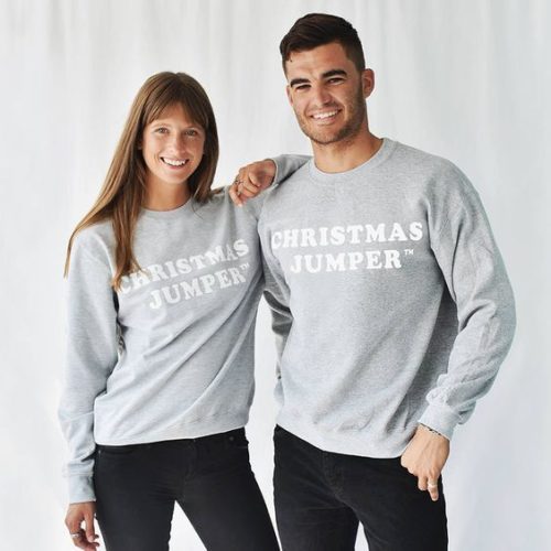 His and hers matching Christmas jumpers in grey