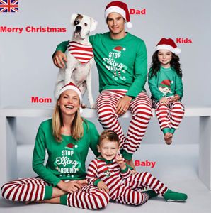 mum dad and baby matching christmas jumpers