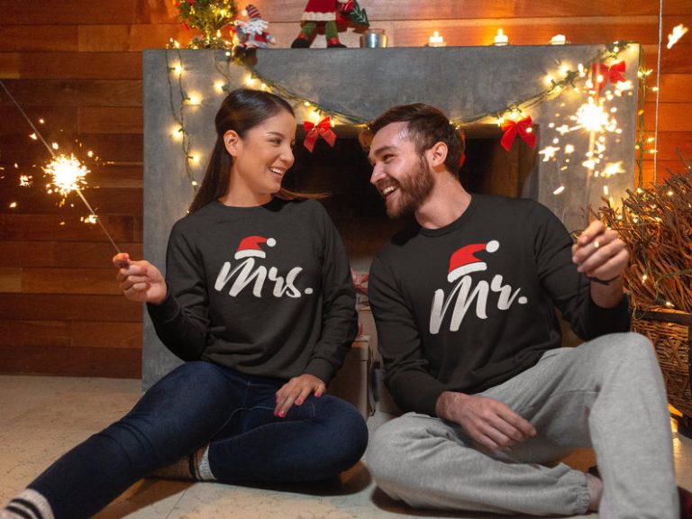 Mr and Mrs matching Christmas sweaters, in black