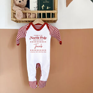 Personalised North Pole Baby's First Christmas Pyjamas Or Rompersuit 2026 from Not On The High Street
